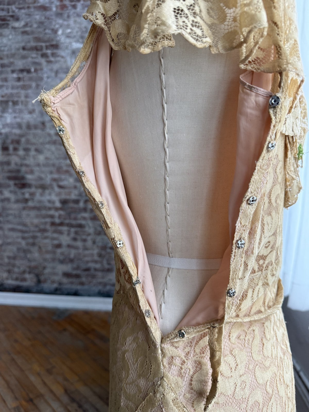 Inside a vintage garment: side snaps running down the seam, no zipper.