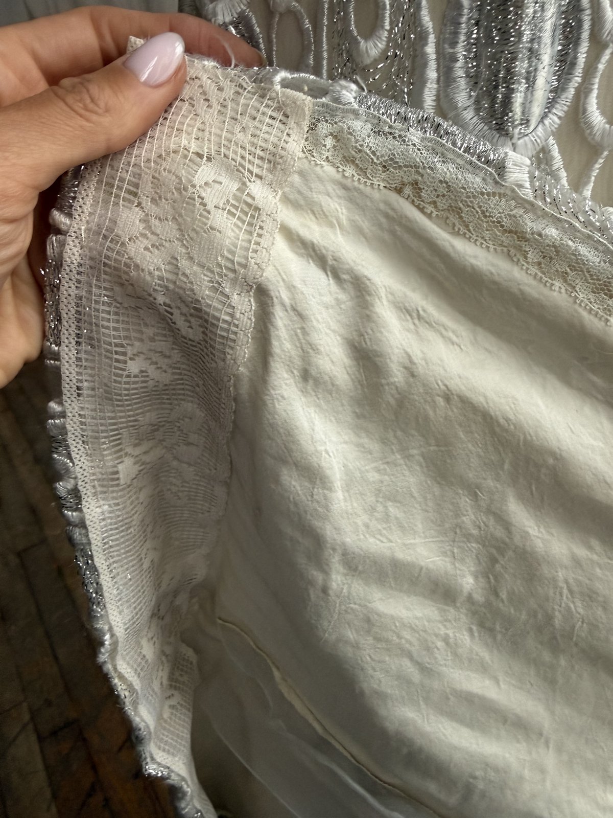 Inside a vintage garment: lace lining the inside seams.
