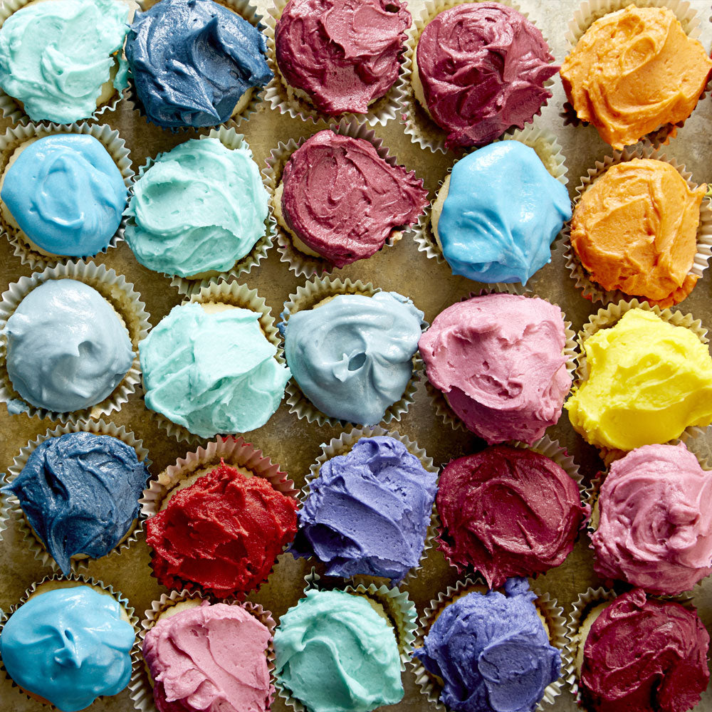 A spread of Sans Bakery cupcakes and gluten-free pastries.