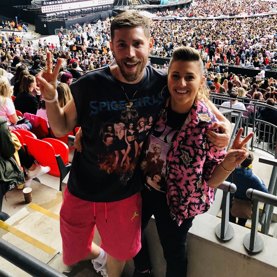 Tanner and a friend in the stands at a Spice Girls stadium show